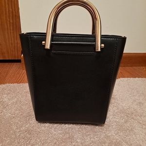 Black handle crossbody bag